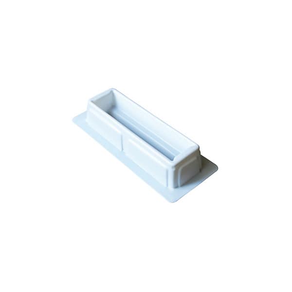 Small white plastic container for storage or organisation purposes.